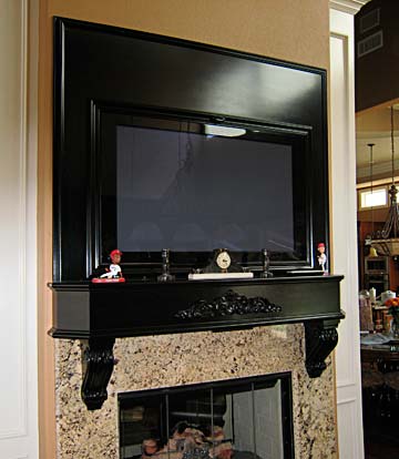fireplace mantel and TV